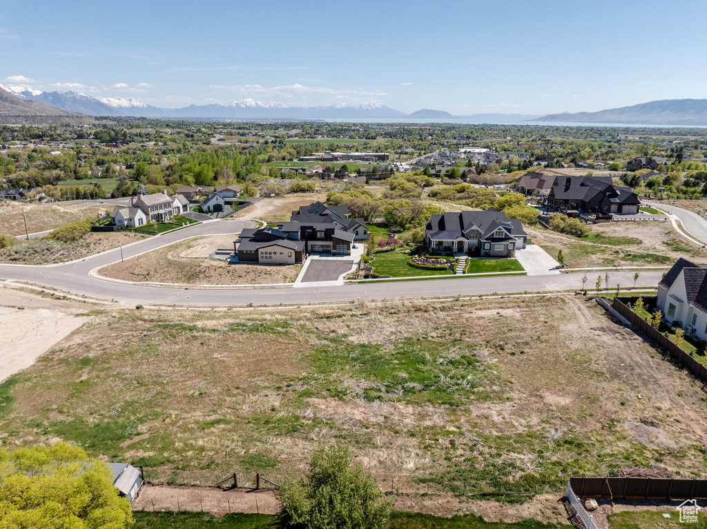 Aerial view of residential area featuring a mountain backdrop