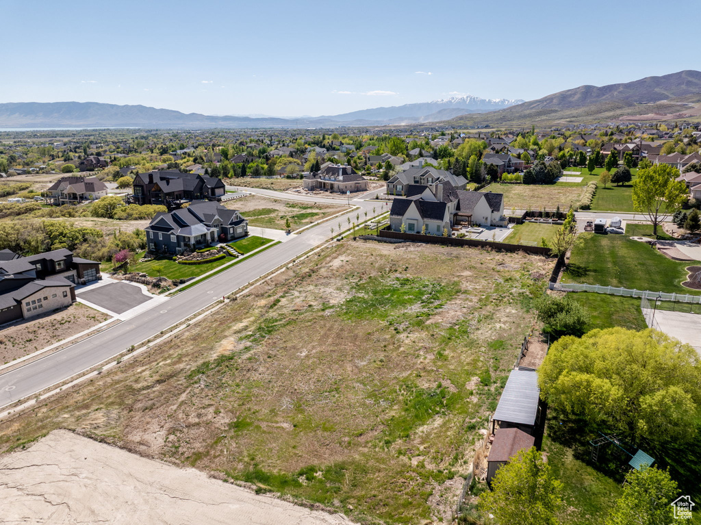 Aerial view of residential area featuring a mountainous background