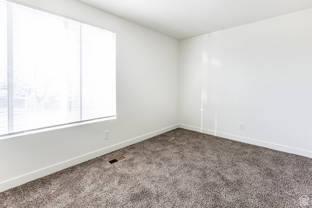 Empty room with carpet flooring