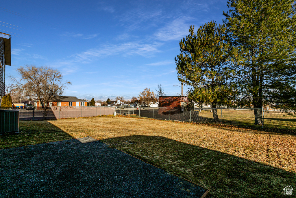 View of yard with central AC unit