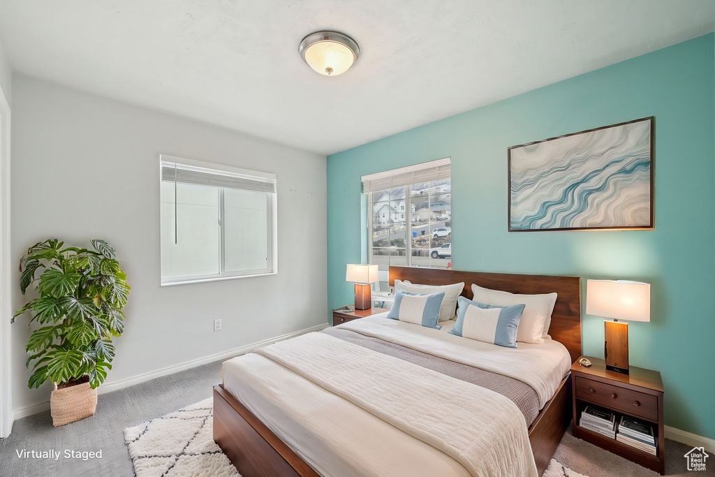 Bedroom with carpet floors and baseboards