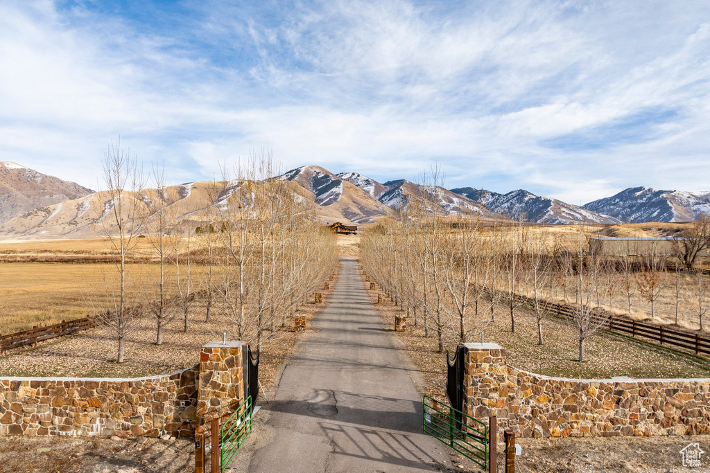 View of mountain background featuring rural landscape