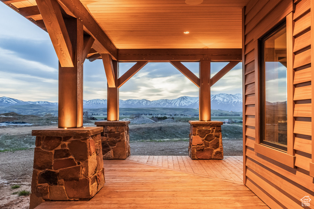Wooden terrace featuring a mountain view