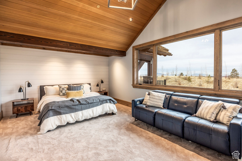 Bedroom with wooden ceiling, carpet floors, vaulted ceiling, and wooden walls