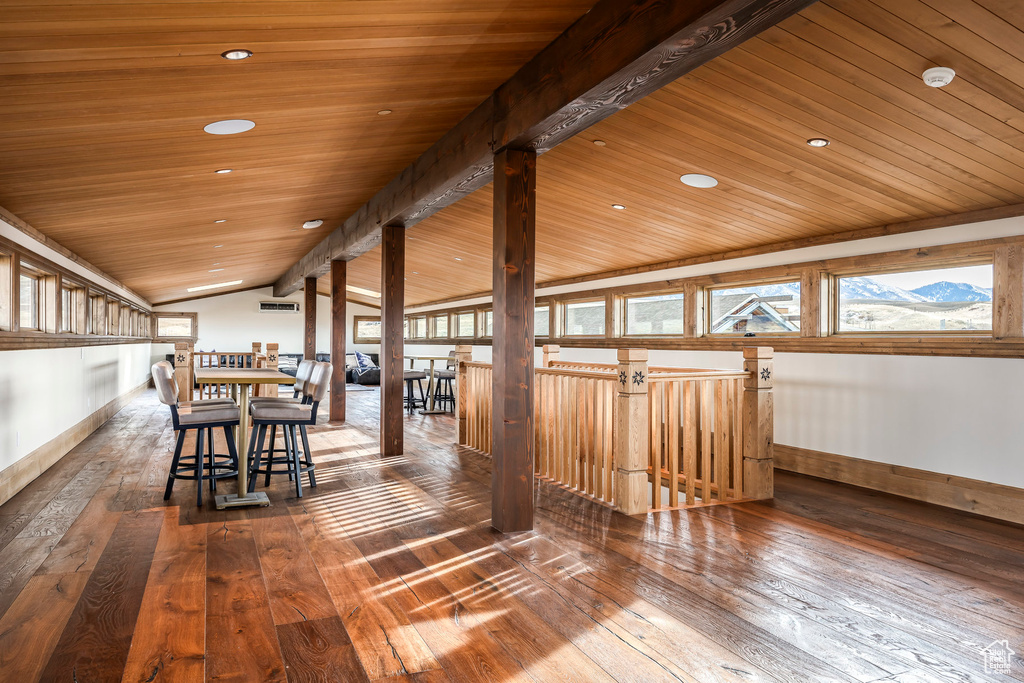 Dining space with vaulted ceiling, wooden ceiling, hardwood / wood-style floors, plenty of natural light, and recessed lighting