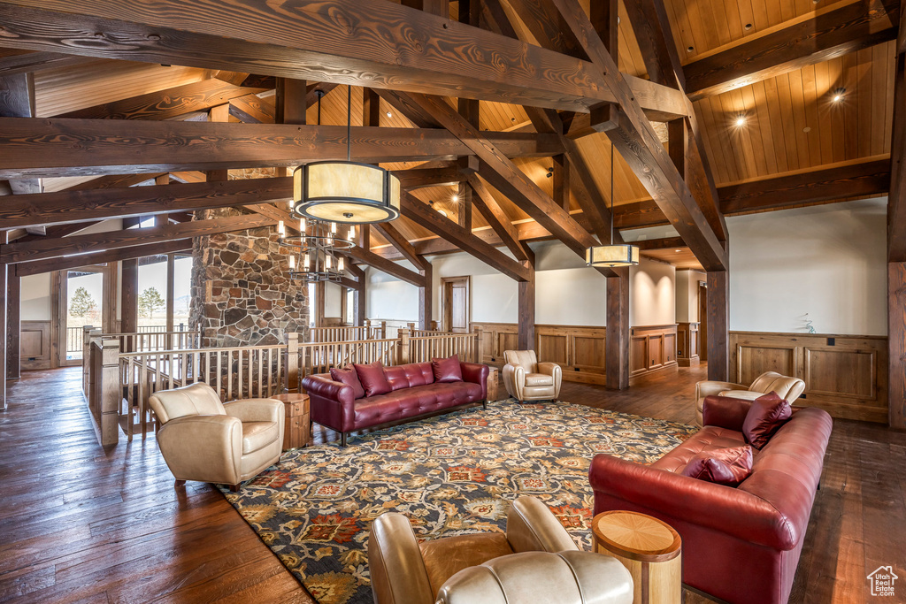 Lobby with a wainscoted wall and wood ceiling