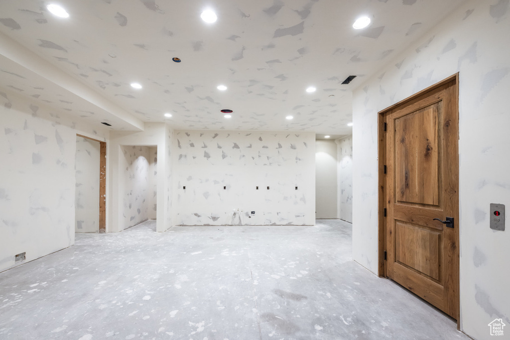 Empty room featuring recessed lighting