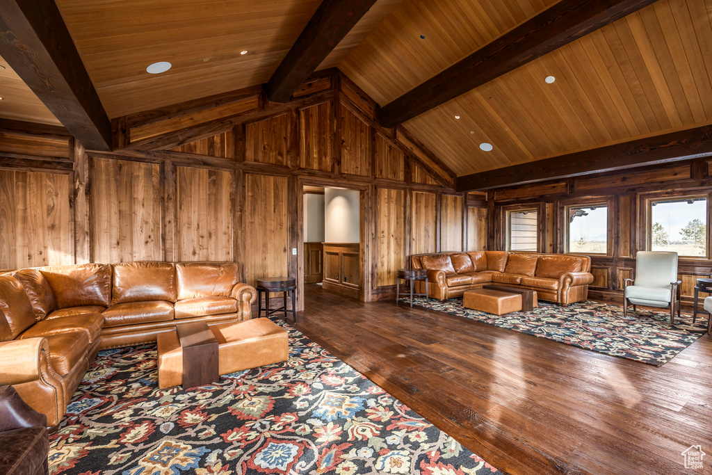 Living area with wooden walls, hardwood / wood-style flooring, and wood ceiling