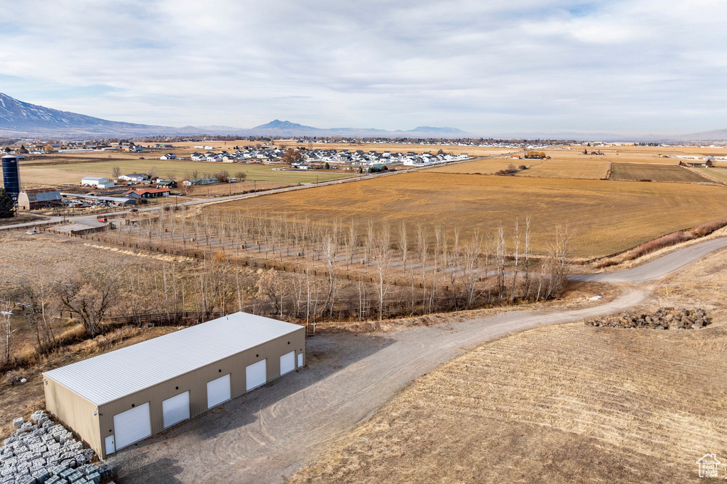 Overview of rural landscape featuring a mountainous background