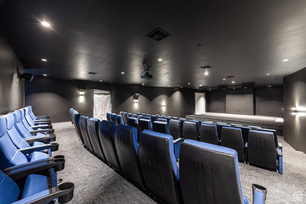 Cinema featuring light carpet and recessed lighting