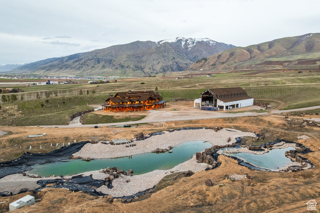 View of property location featuring a mountain backdrop and rural landscape