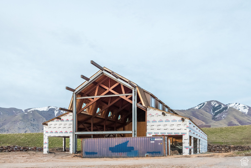 View of property with a mountain view