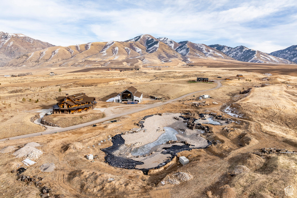 View of mountain backdrop featuring rural landscape