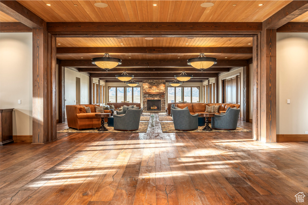 Common area featuring a wood ceiling with exposed beams and recessed lighting