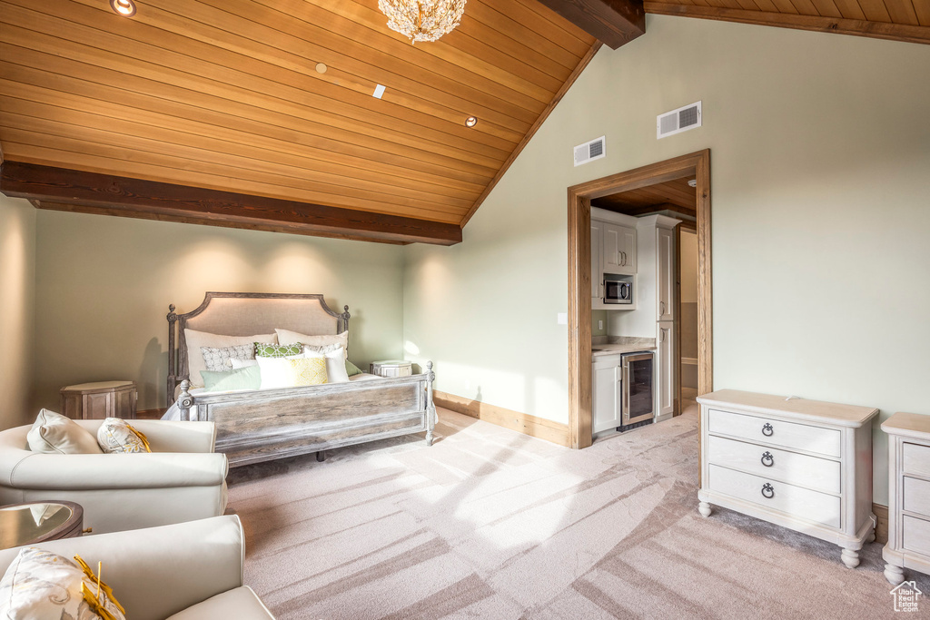 Bedroom featuring a wood ceiling with exposed beams, beverage cooler, light colored carpet, and high vaulted ceiling