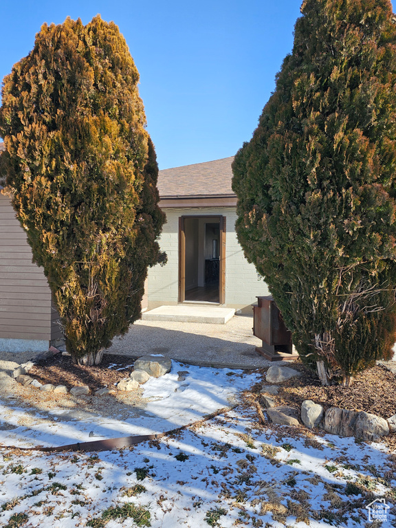 View of snow covered property entrance