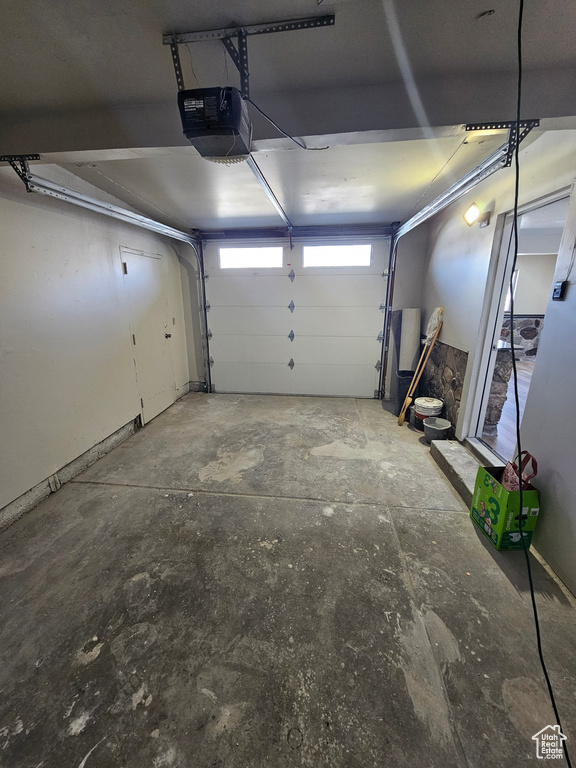 Garage featuring a garage door opener