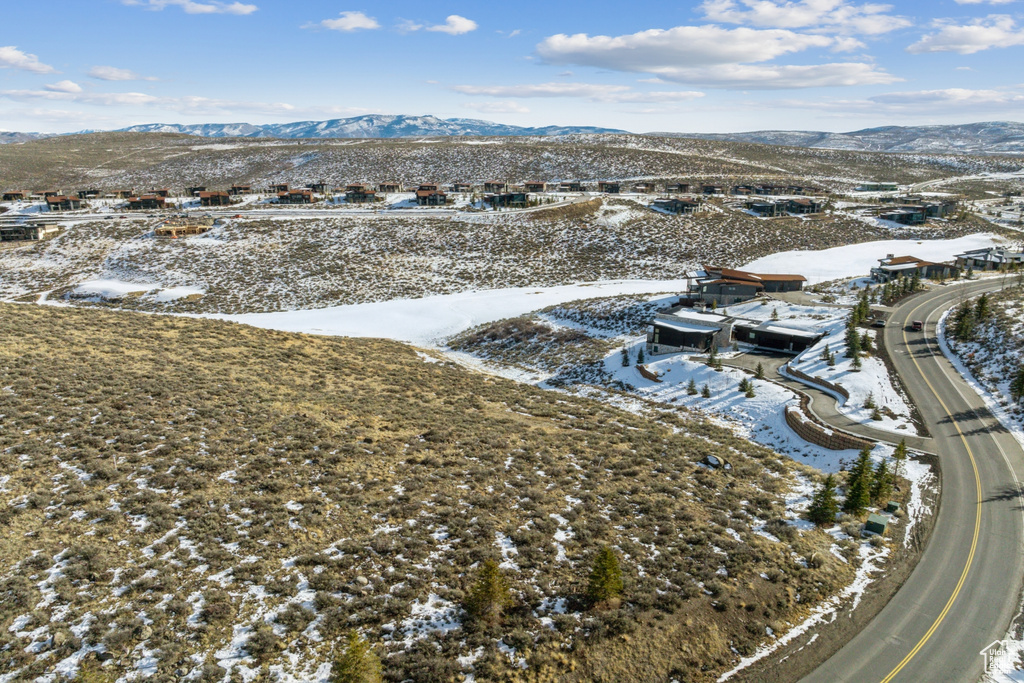 Snowy aerial view featuring a mountain view
