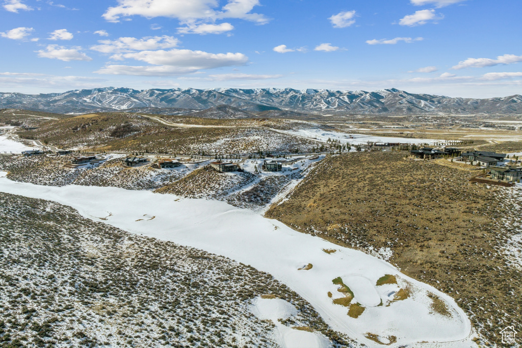 Snowy aerial view with a mountain view