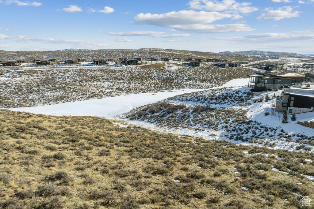 Snowy aerial view featuring a mountain view
