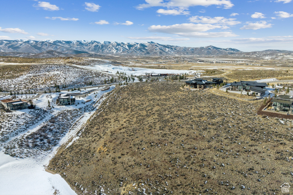 Snowy aerial view with a mountain view
