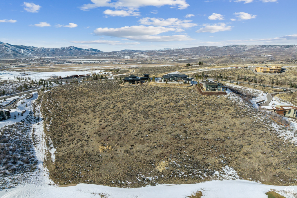 Snowy aerial view featuring a mountain view