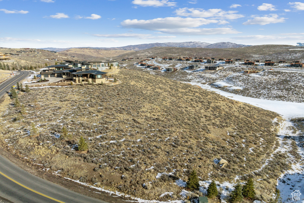 Snowy aerial view with a mountain view