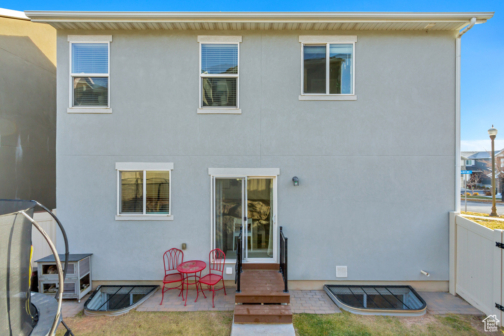 Back of property featuring a patio area