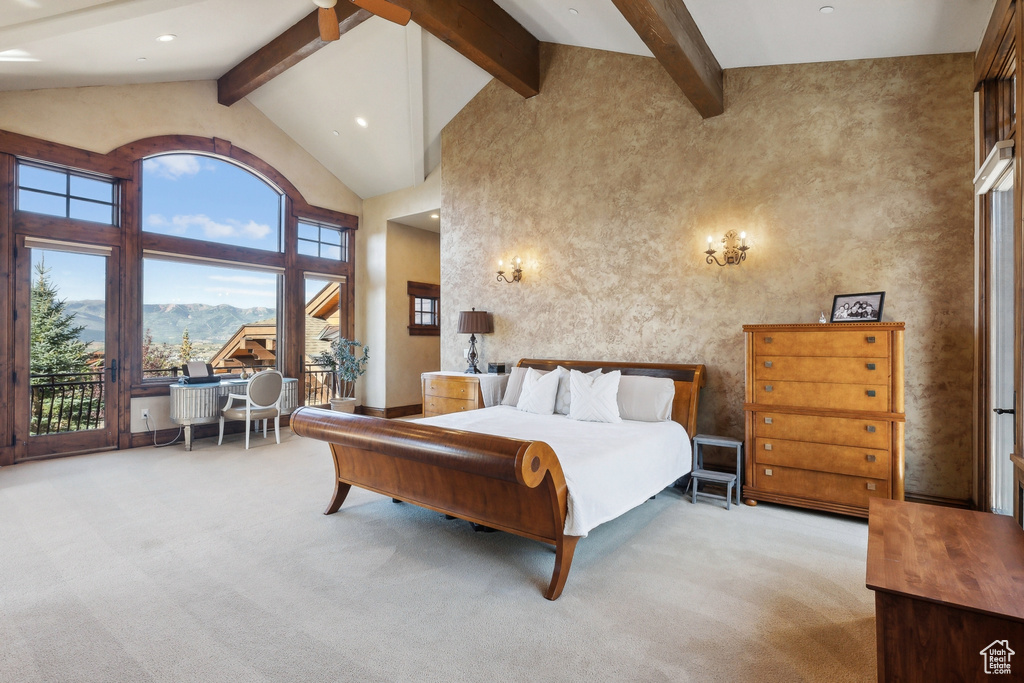 Bedroom featuring carpet floors, high vaulted ceiling, beam ceiling, multiple windows, and access to outside