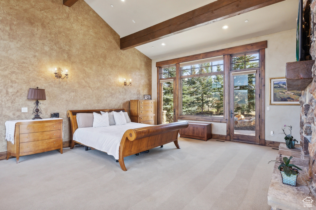 Bedroom featuring access to exterior, beam ceiling, high vaulted ceiling, light carpet, and recessed lighting