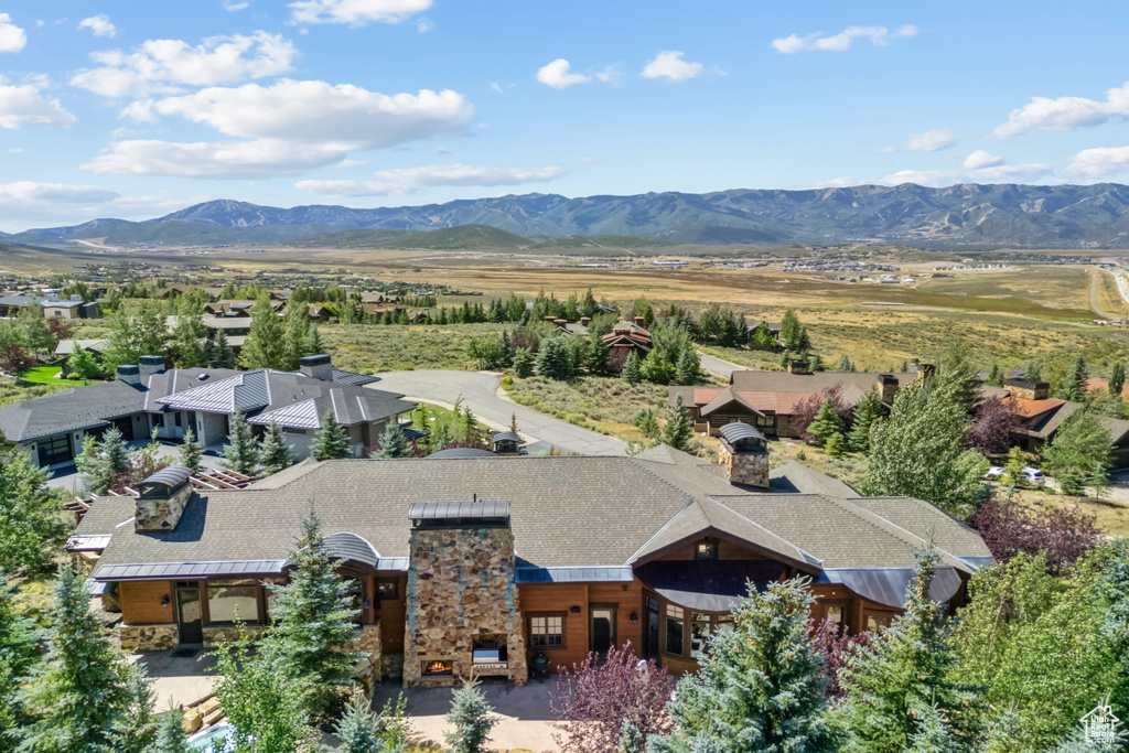 View of subject property featuring a mountainous background