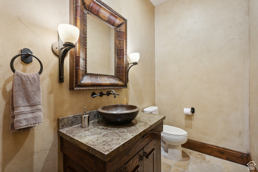 Half bath with vanity and toilet