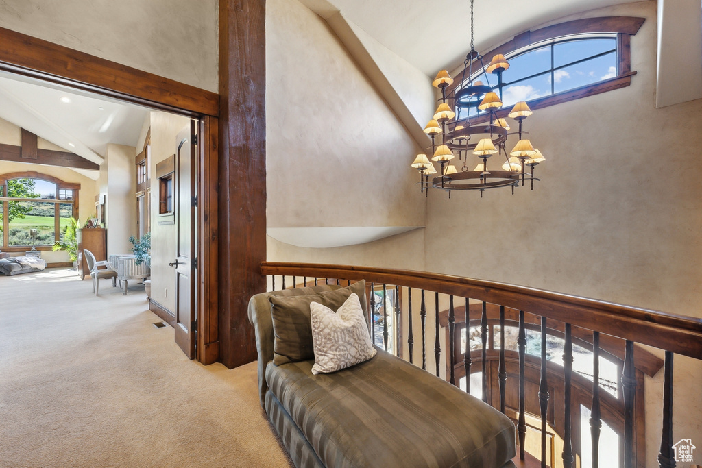 Stairway with a chandelier, carpet flooring, high vaulted ceiling, beam ceiling, and recessed lighting