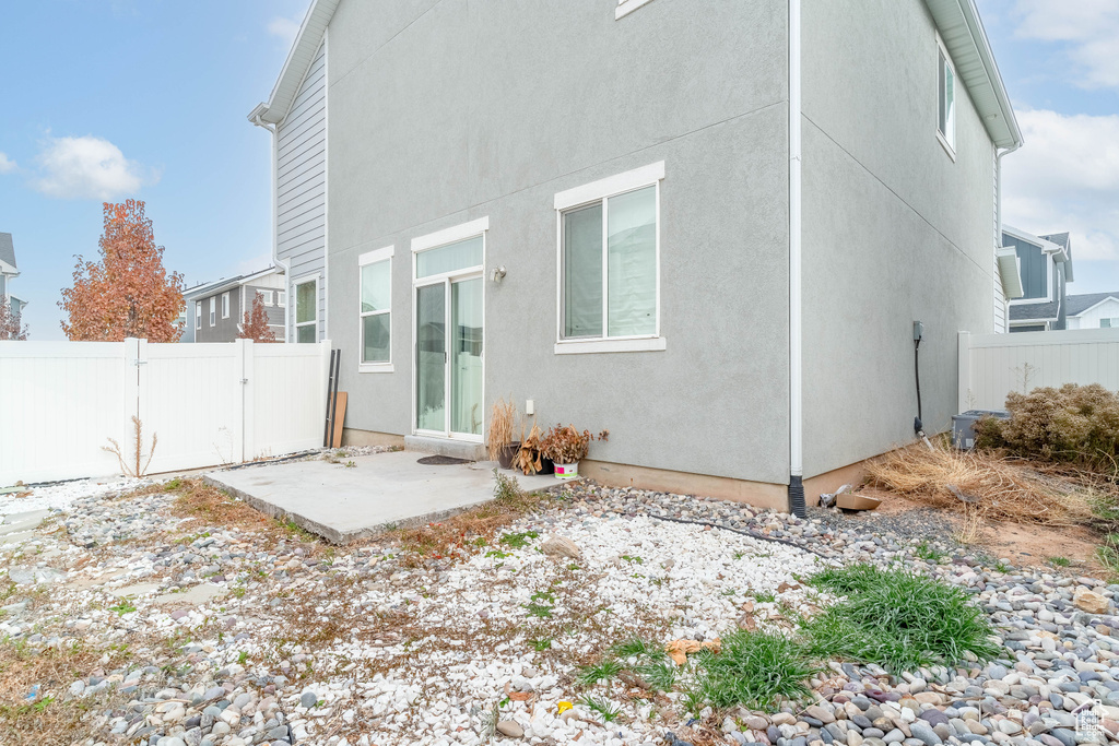 Back of property featuring a patio