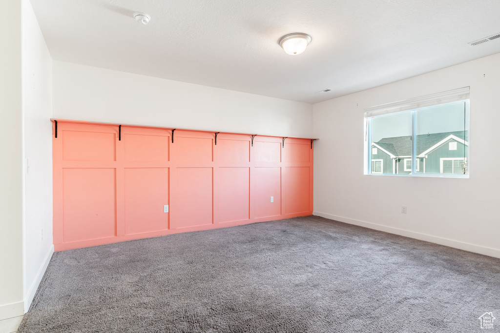 Unfurnished bedroom with carpet floors and a closet