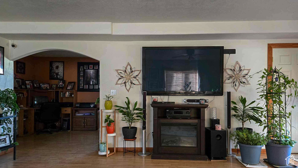 Living room with hardwood / wood-style flooring