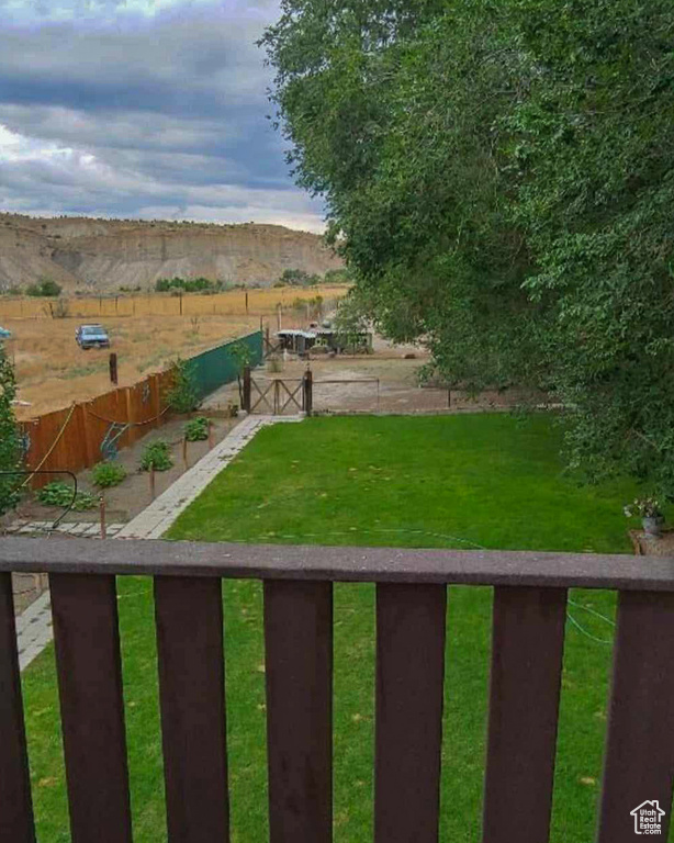 View of yard with a rural view