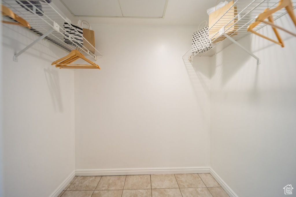 Spacious closet featuring tile patterned flooring