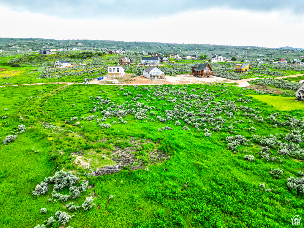 Birds eye view of property with a rural view