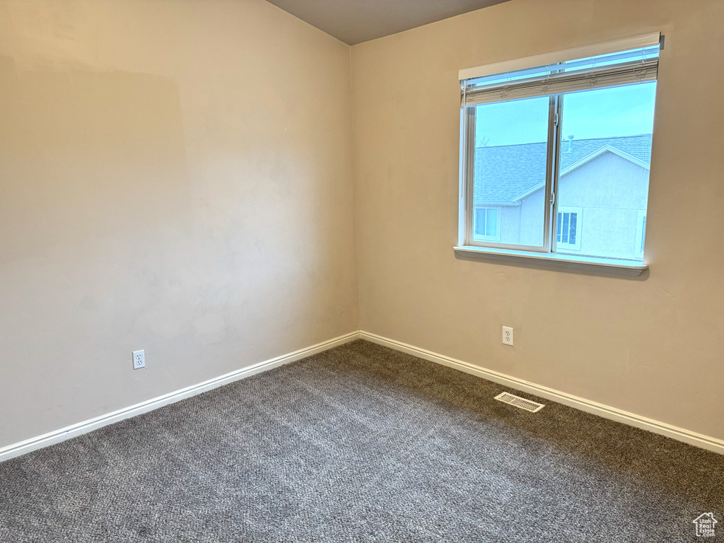 View of carpeted spare room