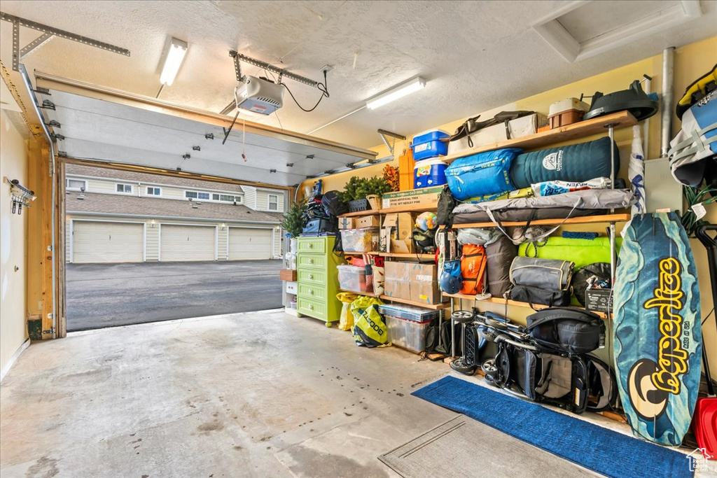 Garage featuring a garage door opener