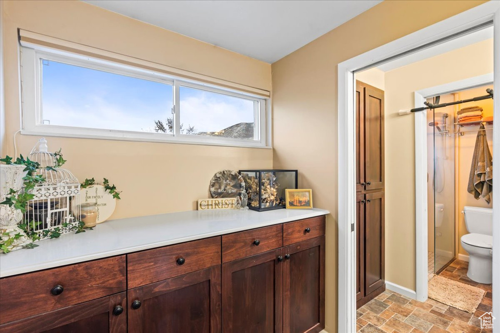 Interior space featuring toilet and vanity