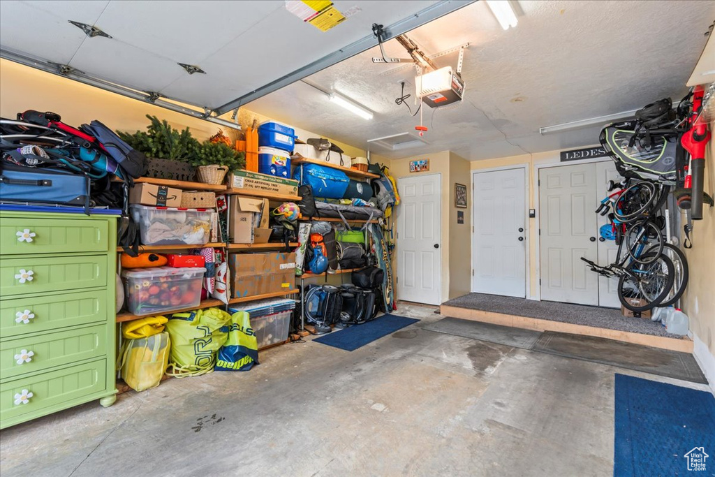 Garage featuring a garage door opener