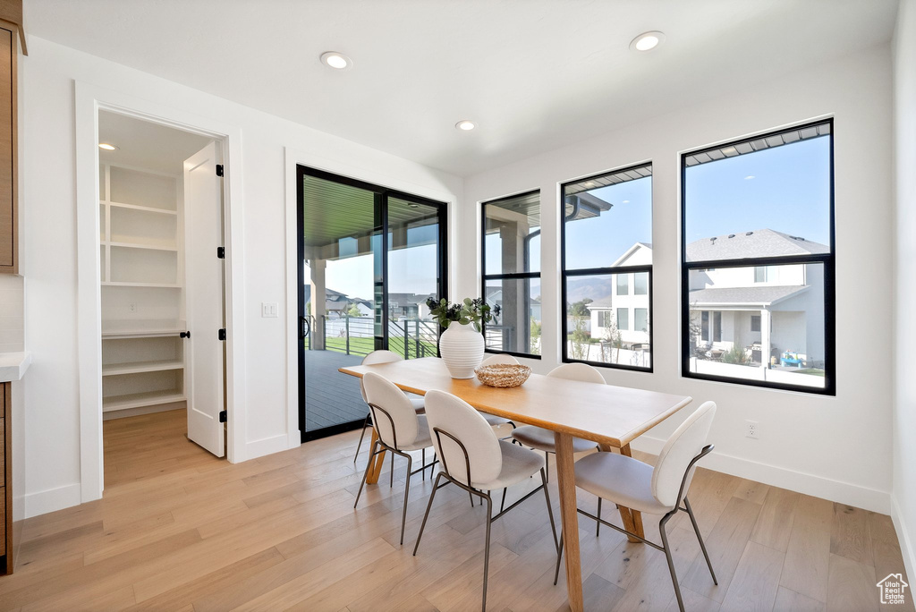 Dining area with light hardwood / wood-style floors