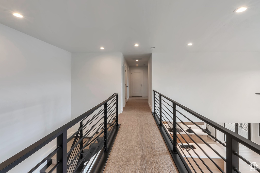 Hall with light colored carpet