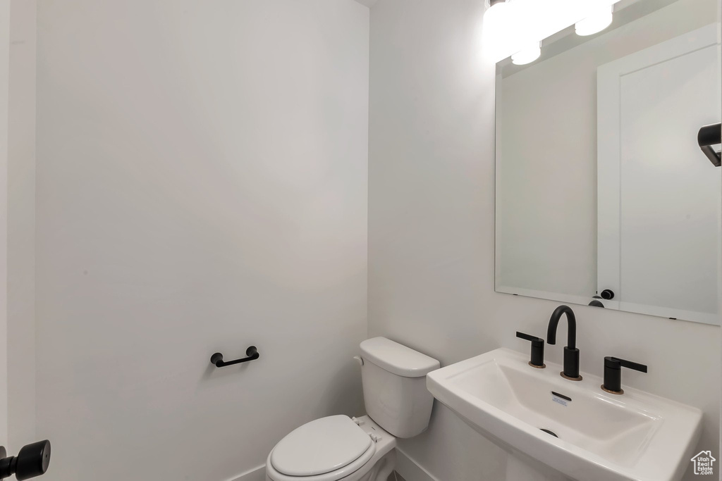 Bathroom with sink and toilet