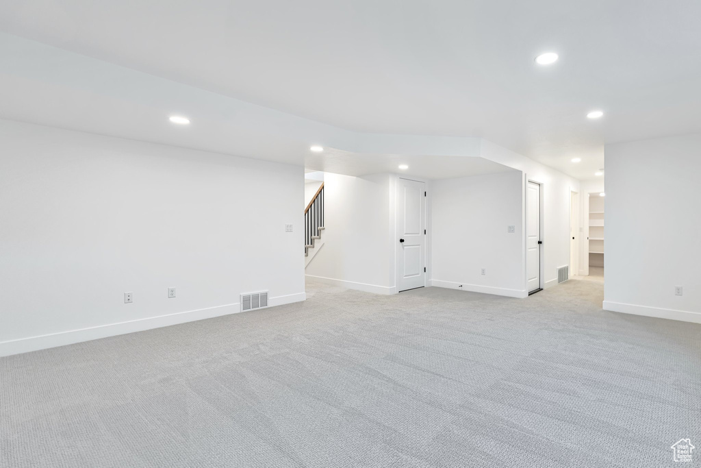 Basement with light carpet