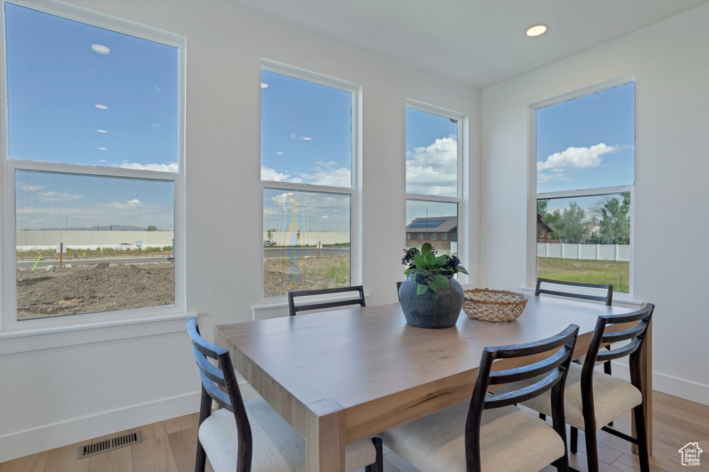 Dining room with light hardwood / wood-style floors