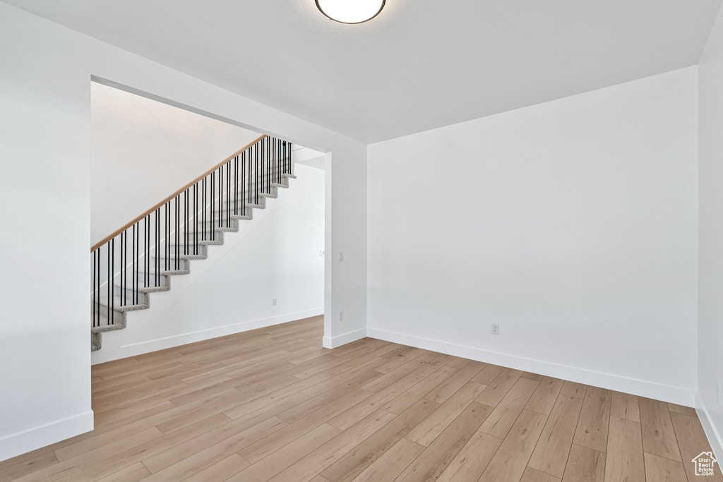 Unfurnished room with light wood-type flooring