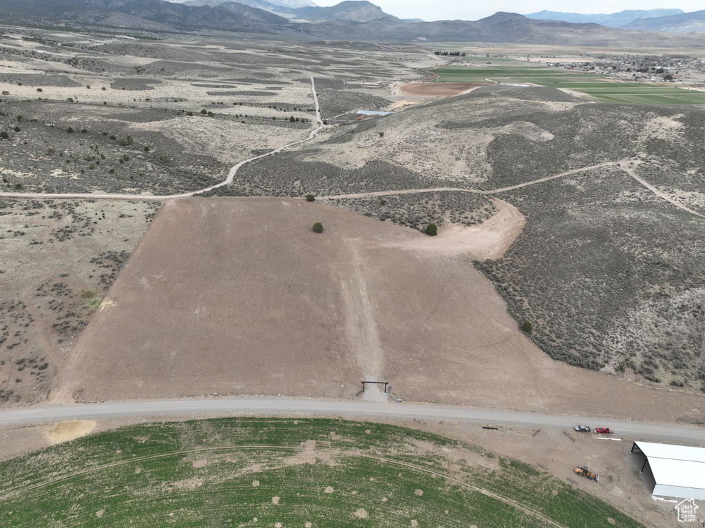 Aerial view featuring a rural view and a mountain view